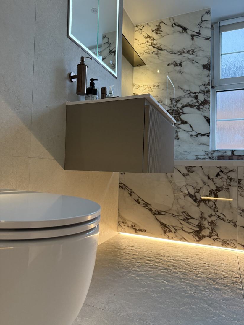 Marble family bathroom with floating vanity